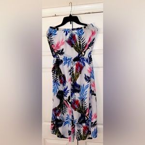 Amazing, Sleeveless Jumpsuit with Beautiful Flower Accent and Pockets!